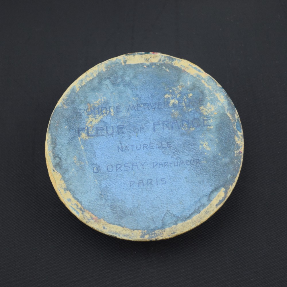 A circular translucent opalescent glass box lid featuring a high-relief moulded depiction of two figures amidst swirling water bubbles. View V