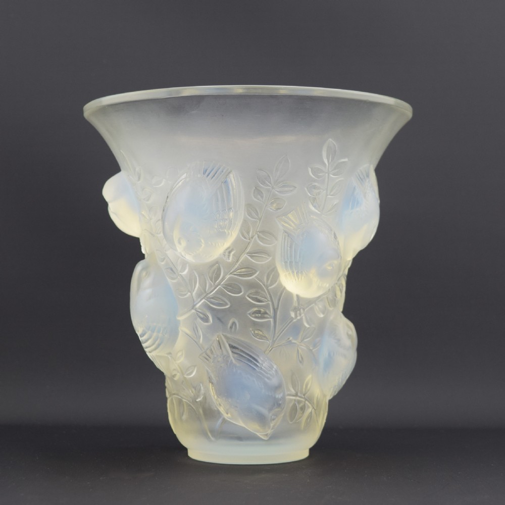 An Art Deco opalescent glass vase with a flared rim featuring moulded high-relief motifs of birds amongst leaves. View II