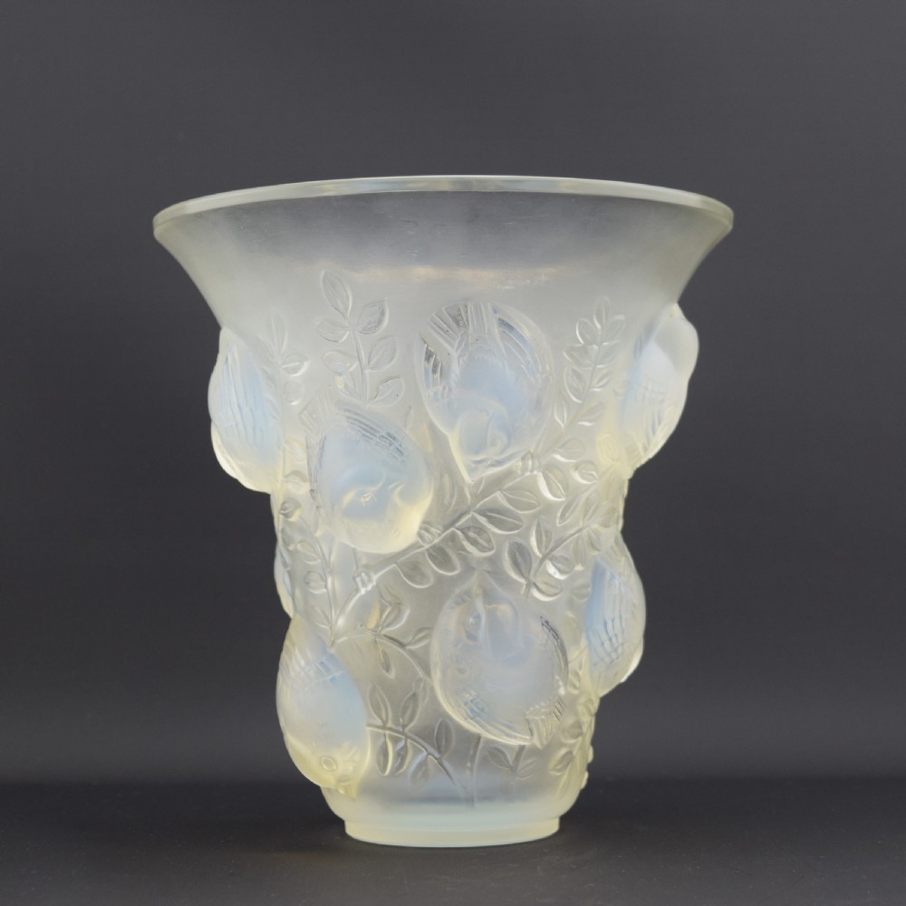 An Art Deco opalescent glass vase with a flared rim featuring moulded high-relief motifs of birds amongst leaves. View III