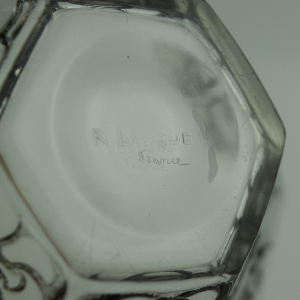 A hexagonal Art Deco clear glass bowl featuring a moulded grape pattern with dark patinated recesses. View VI