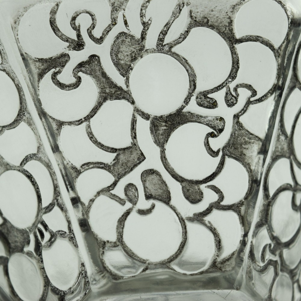 A hexagonal Art Deco clear glass bowl featuring a moulded grape pattern with dark patinated recesses. View VII