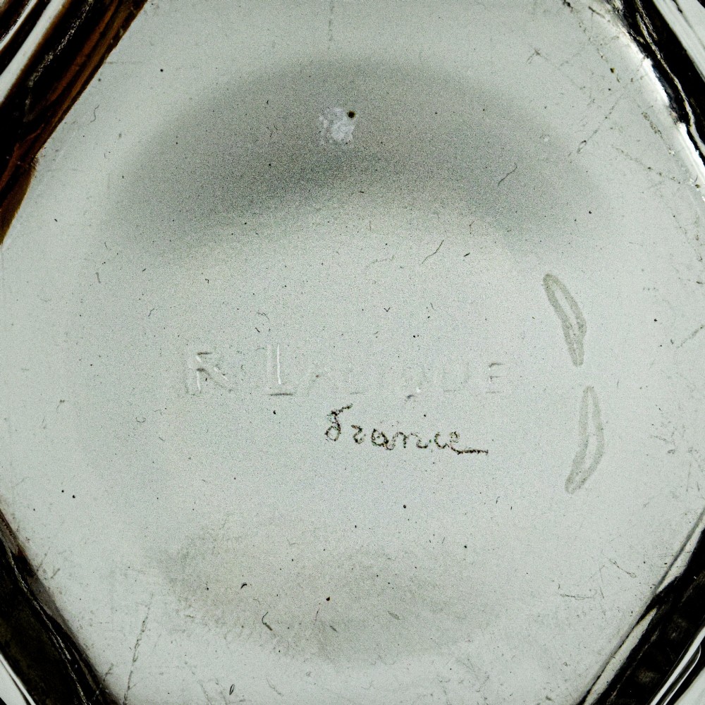 A hexagonal Art Deco clear glass bowl featuring a moulded grape pattern with dark patinated recesses. View VIII