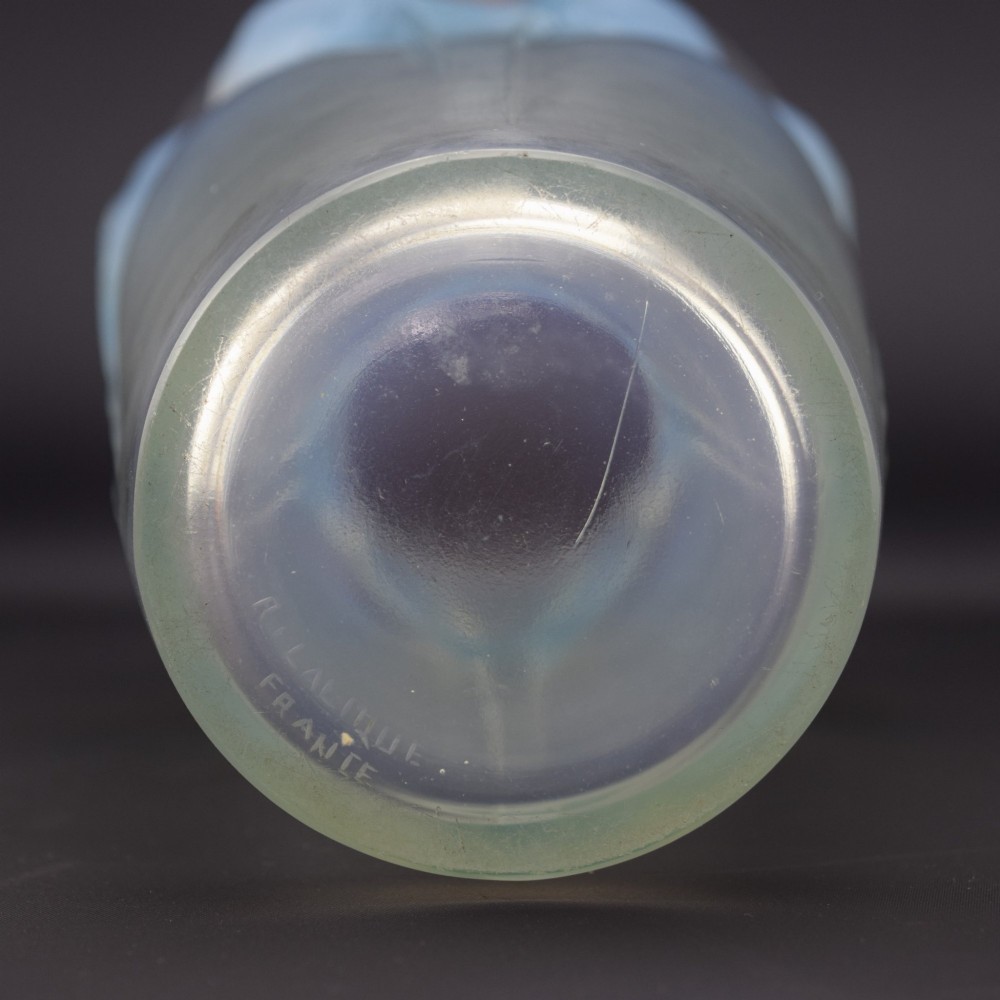 An Art Deco Rene Lalique opalescent glass vase featuring high relief carvings of budgerigars perched on branches with subtle blue staining. View IX