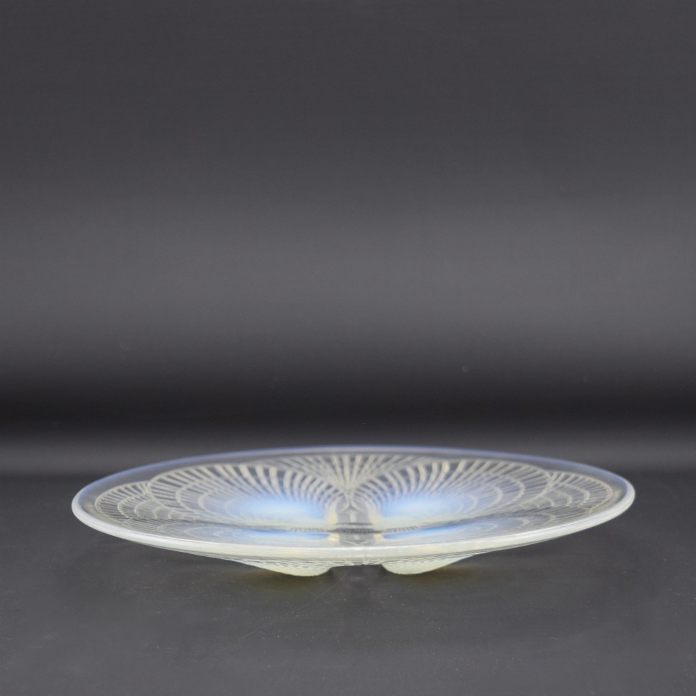 An Art Deco opalescent glass plate by Rene Lalique featuring a relief-moulded four-shell design with translucent blue highlights. View III