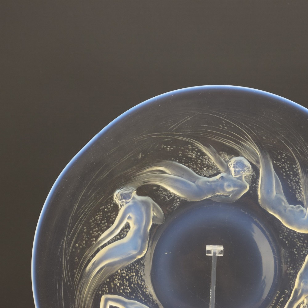 A circular Lalique opalescent glass plate featuring a central motif of six relief-moulded swimming water nymphs. View II