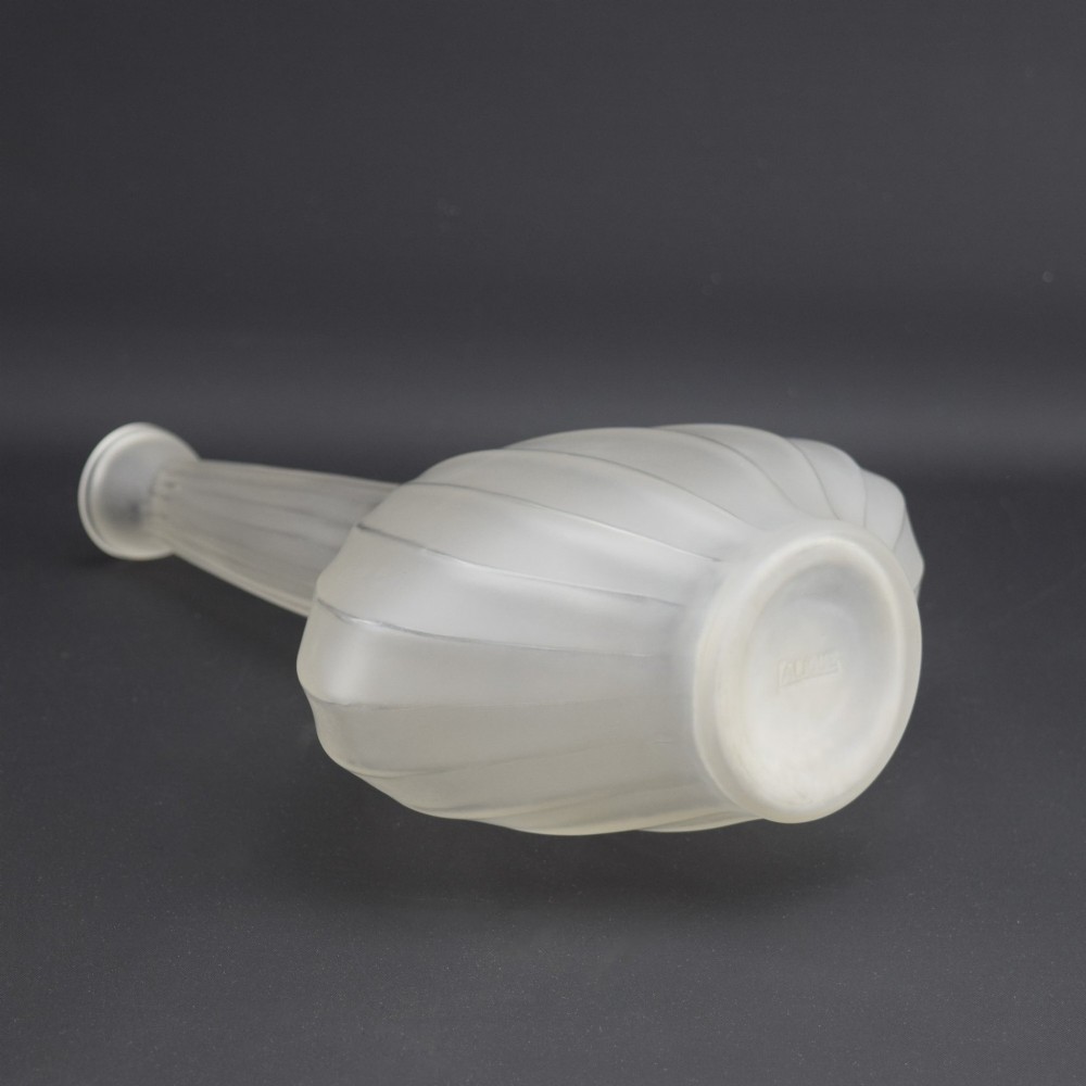 A frosted clear glass decanter featuring a wide, vertically ribbed bulbous body tapering into a slender neck. View V