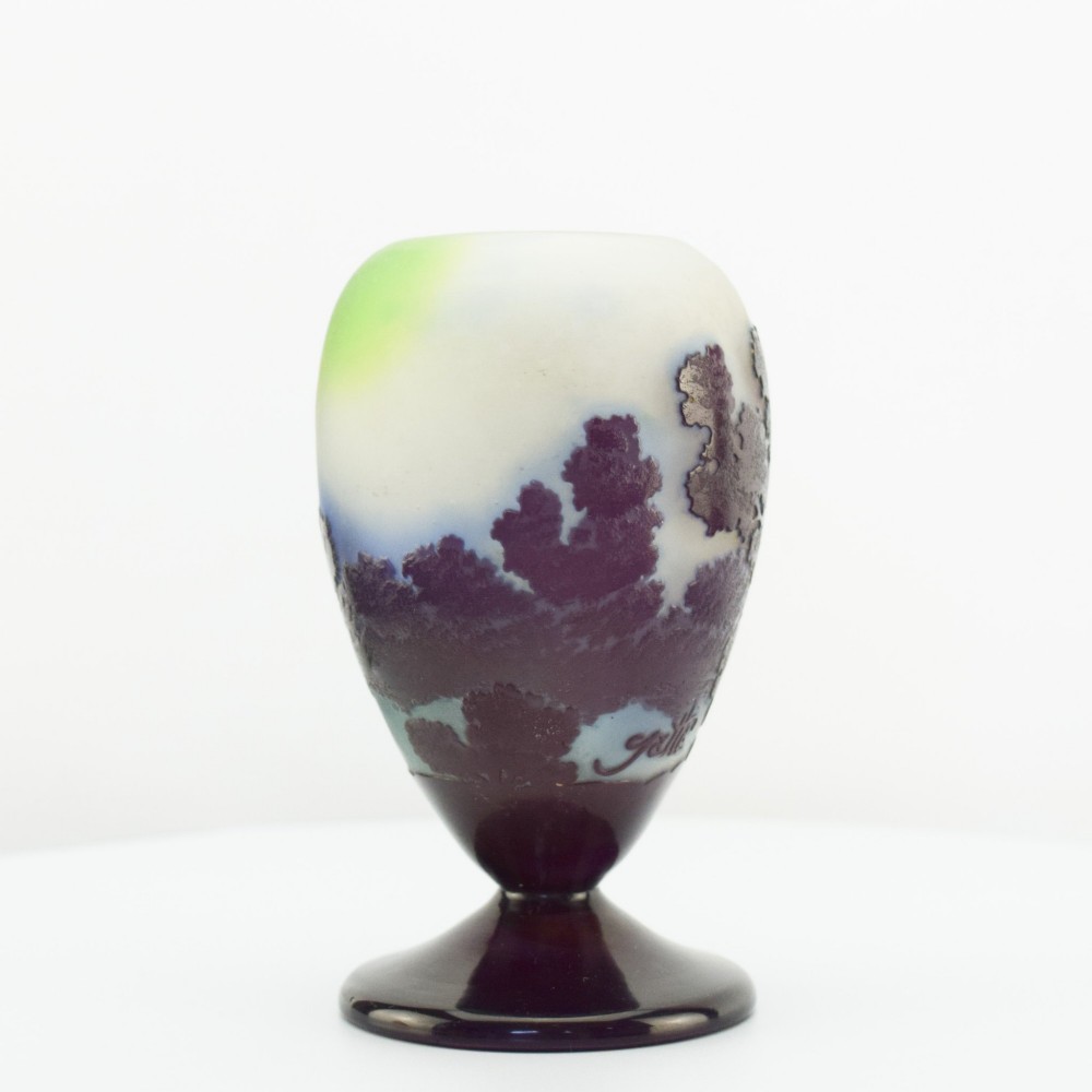 An Art Nouveau cameo glass footed vase depicting a dark purple tree landscape against a frosted green and white background. View III