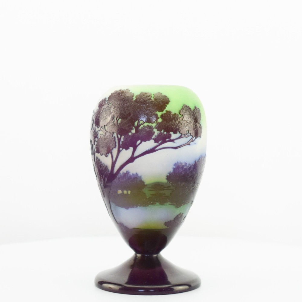 An Art Nouveau cameo glass footed vase depicting a dark purple tree landscape against a frosted green and white background. View VIII