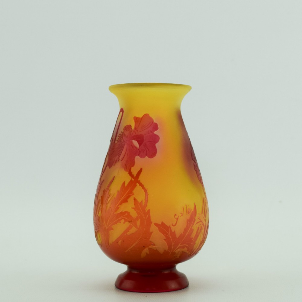 An Art Nouveau French cameo glass footed vase featuring an acid-etched red poppy design over a translucent yellow and orange ground. View II