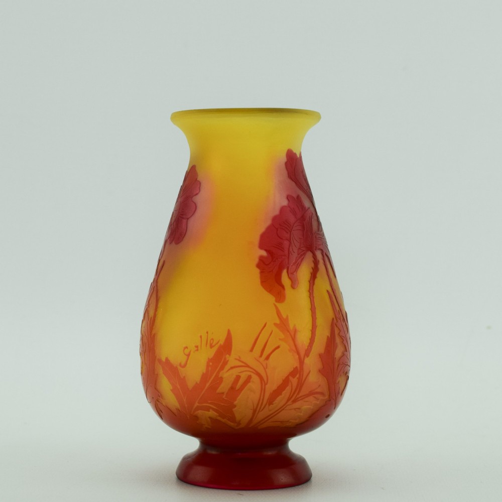 An Art Nouveau French cameo glass footed vase featuring an acid-etched red poppy design over a translucent yellow and orange ground. View III