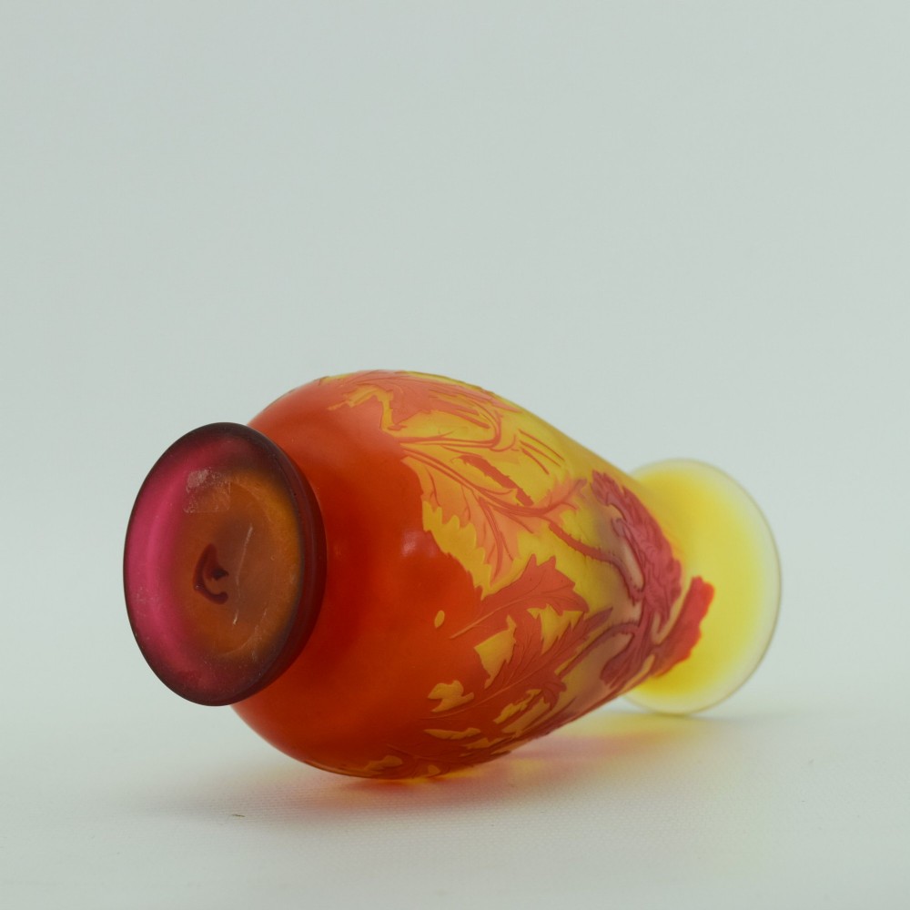 An Art Nouveau French cameo glass footed vase featuring an acid-etched red poppy design over a translucent yellow and orange ground. View VII