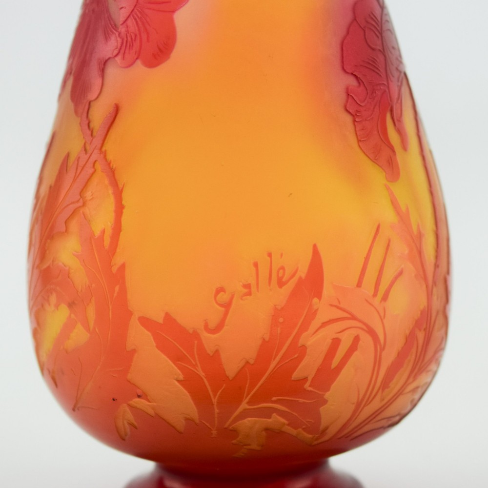 An Art Nouveau French cameo glass footed vase featuring an acid-etched red poppy design over a translucent yellow and orange ground. View VIII