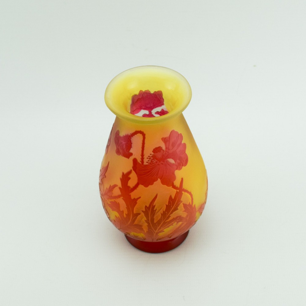 An Art Nouveau French cameo glass footed vase featuring an acid-etched red poppy design over a translucent yellow and orange ground. View XII