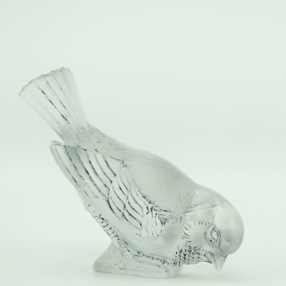 A Rene Lalique frosted glass paperweight shaped like a sparrow with its head turned downwards. View VI