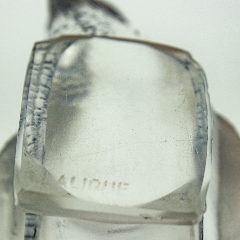 A Rene Lalique frosted glass paperweight shaped like a sparrow with its head turned downwards. View VII