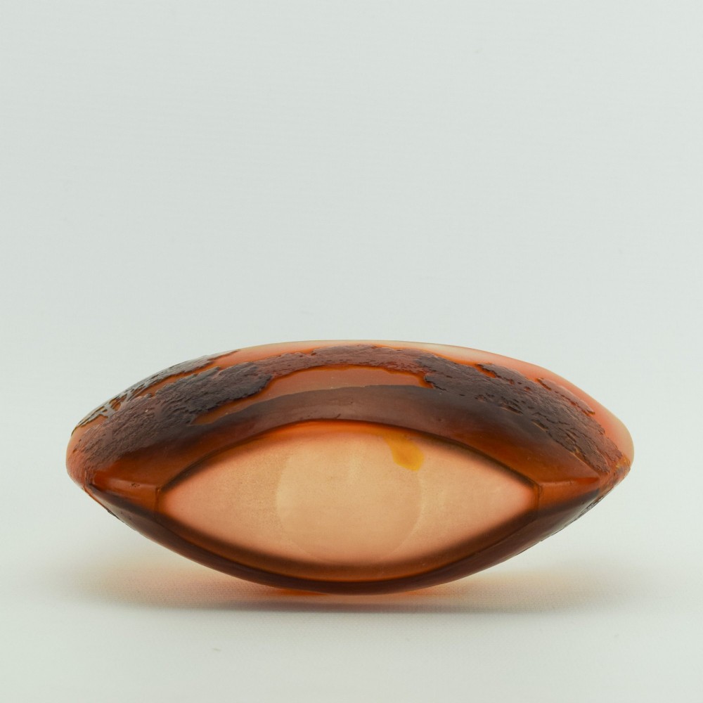 A crescent-shaped Art Nouveau cameo glass vase featuring an acid-etched river landscape in shades of burnt orange and dark brown against a frosted background. View VII