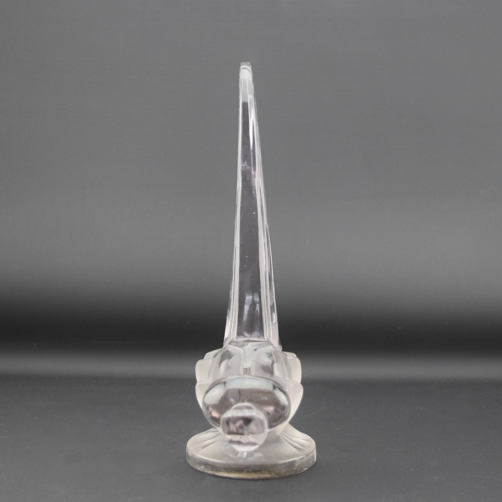 An Art Deco clear and frosted glass car mascot sculpted in the form of a stylised dragonfly with upright wings resting on a circular base. View II