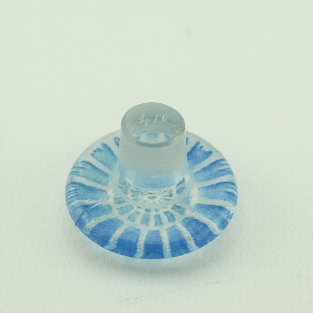 A circular Art Deco clear glass perfume bottle featuring relief butterfly motifs stained in blue with a matching circular glass stopper. View XI