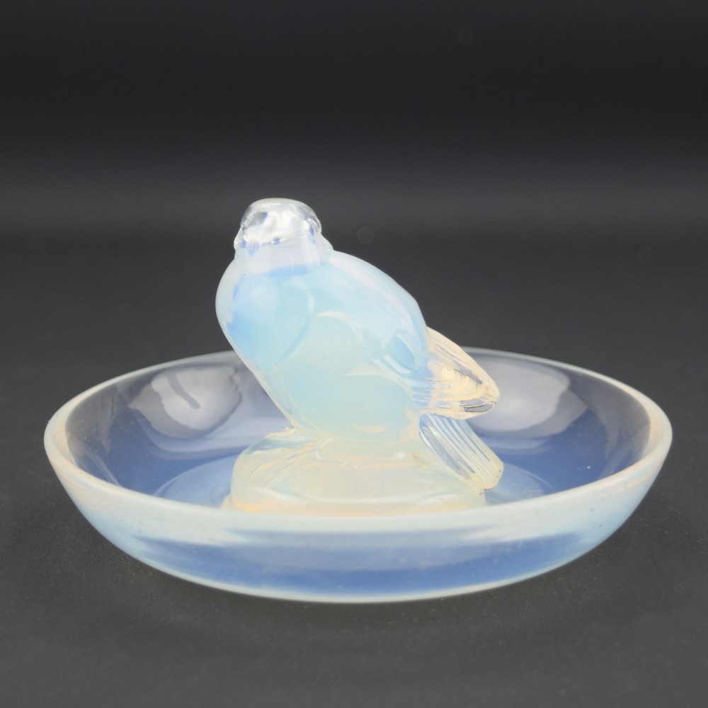 An Art Deco opalescent glass circular dish featuring a sculpted sparrow figure standing in the centre. View V