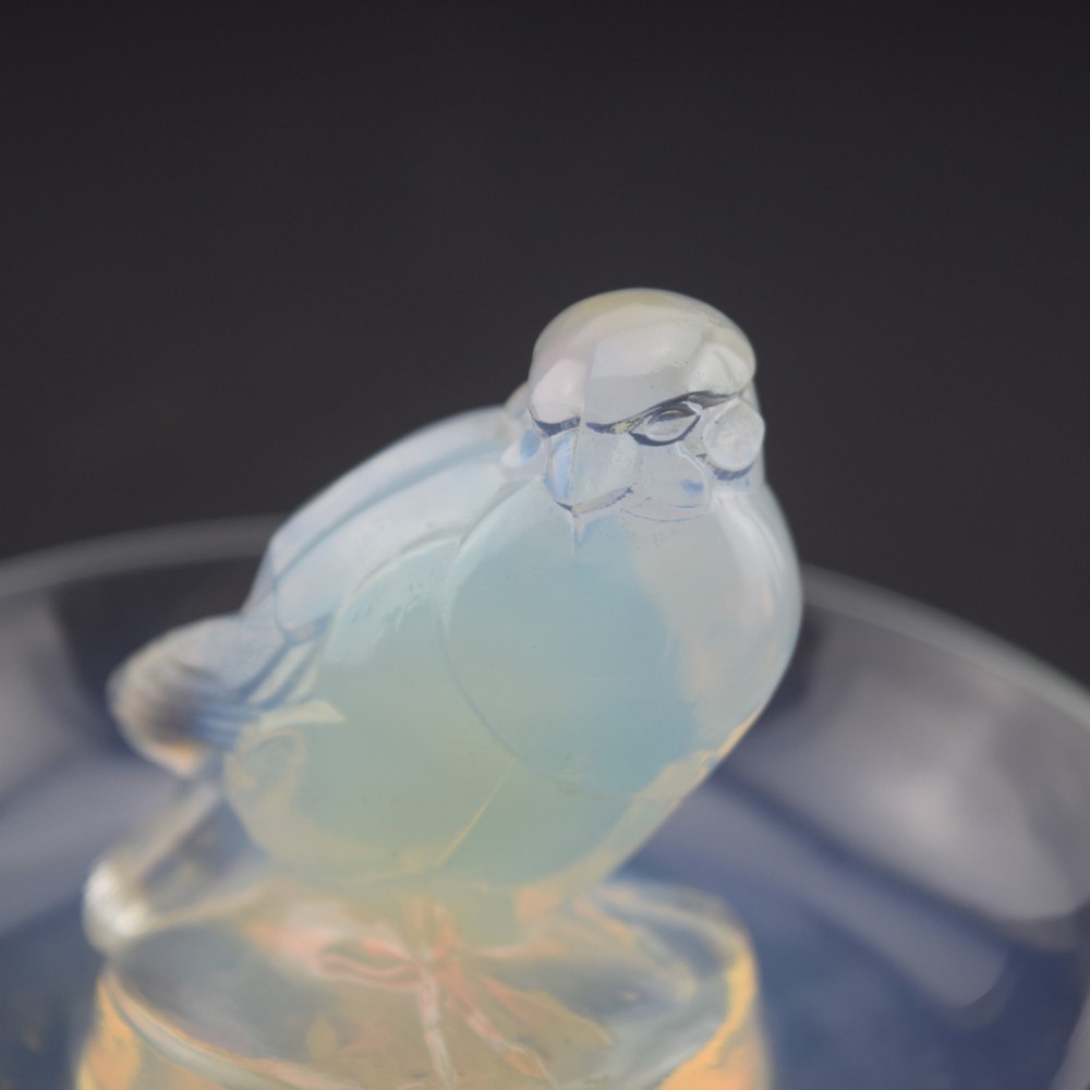 An Art Deco opalescent glass circular dish featuring a sculpted sparrow figure standing in the centre. View VII