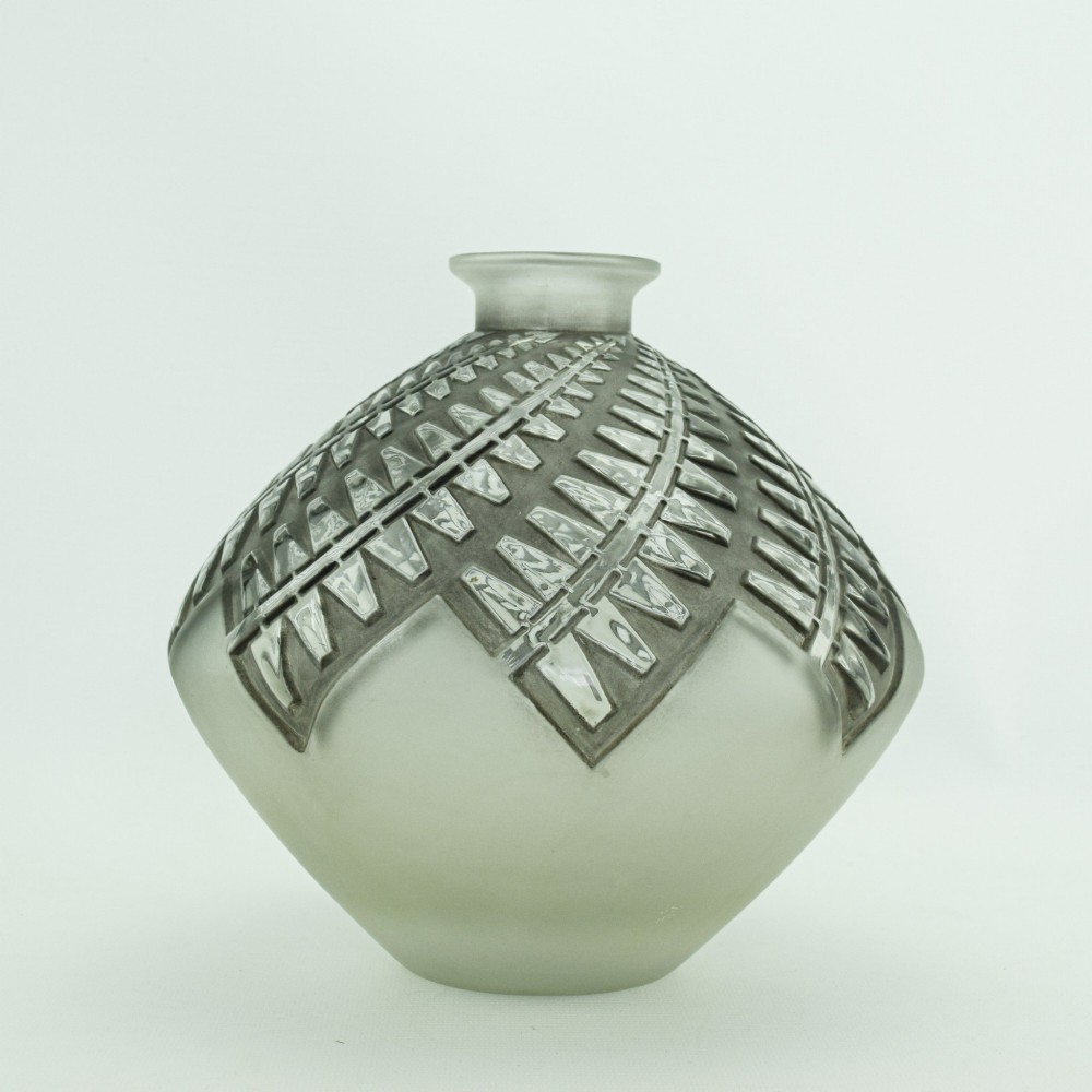 An Art Deco frosted clear glass vase featuring a rounded body with raised geometric chevron reliefs and a short flared neck. View II