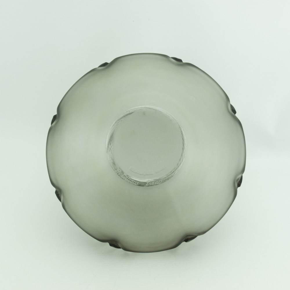 An Art Deco frosted clear glass vase featuring a rounded body with raised geometric chevron reliefs and a short flared neck. View VII