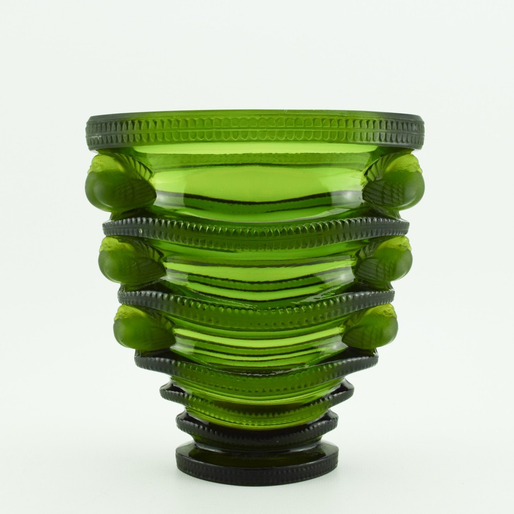 An olive green moulded glass vase with tiered horizontal ridging and frosted bird motifs descending the tapered sides. View II