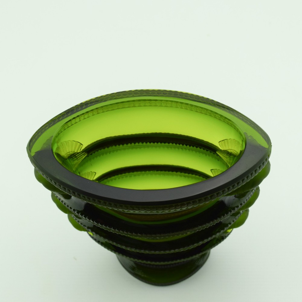 An olive green moulded glass vase with tiered horizontal ridging and frosted bird motifs descending the tapered sides. View IX