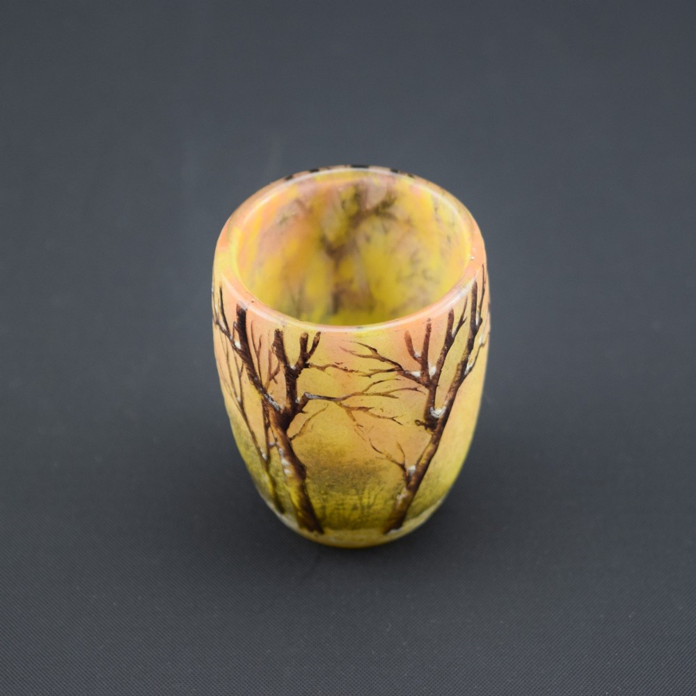 A small barrel-shaped frosted glass vase featuring an enamelled winter landscape with bare trees against a yellow and orange sky. View VIII
