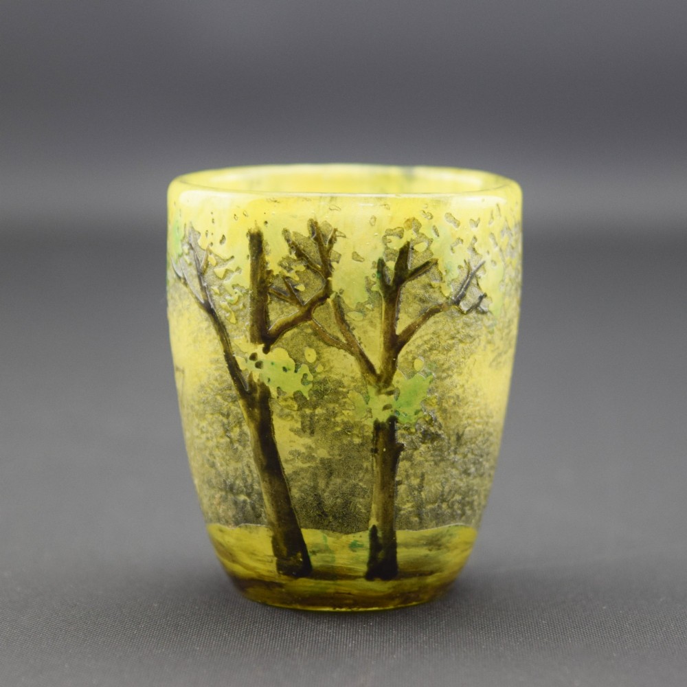 An Art Nouveau yellow cameo glass miniature vase featuring acid-etched and enamelled dark green tree trunks and summer foliage. View IV