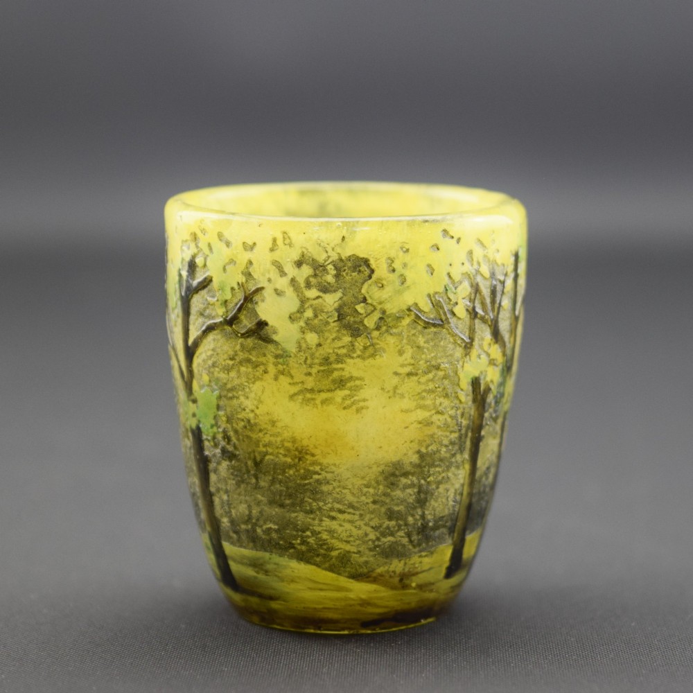 An Art Nouveau yellow cameo glass miniature vase featuring acid-etched and enamelled dark green tree trunks and summer foliage. View V