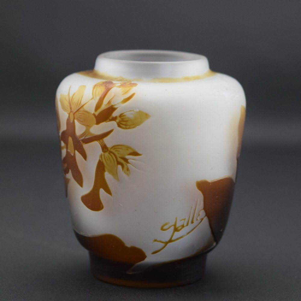 A small Art Nouveau cameo glass vase featuring brown acid-etched floral motifs over a frosted white background. View II