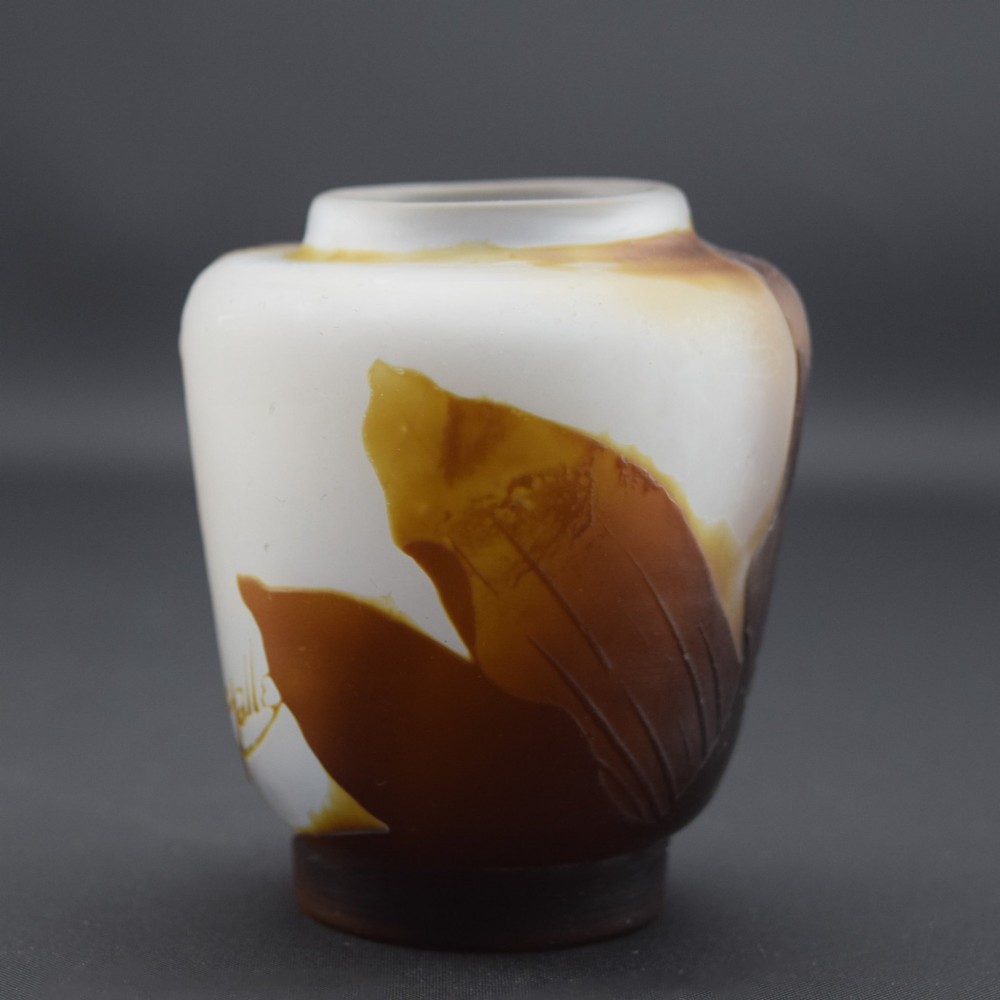 A small Art Nouveau cameo glass vase featuring brown acid-etched floral motifs over a frosted white background. View III