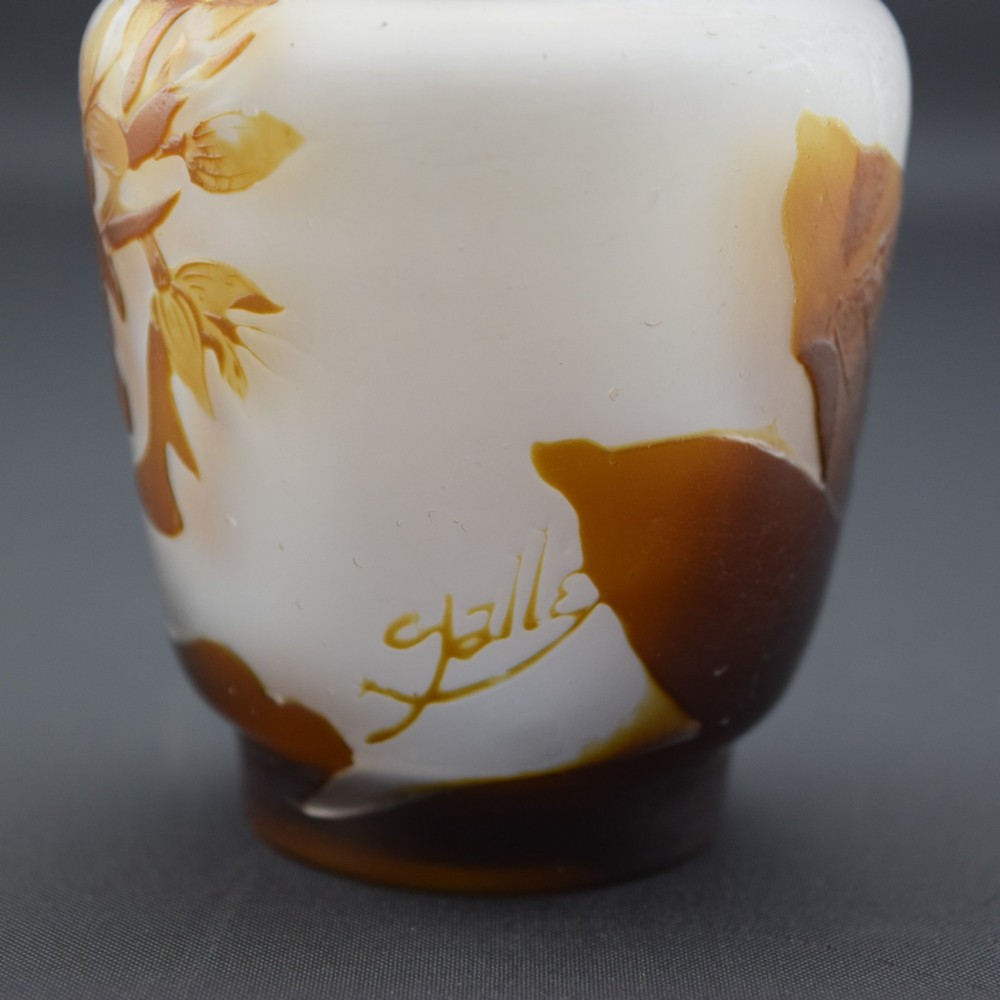 A small Art Nouveau cameo glass vase featuring brown acid-etched floral motifs over a frosted white background. View VII