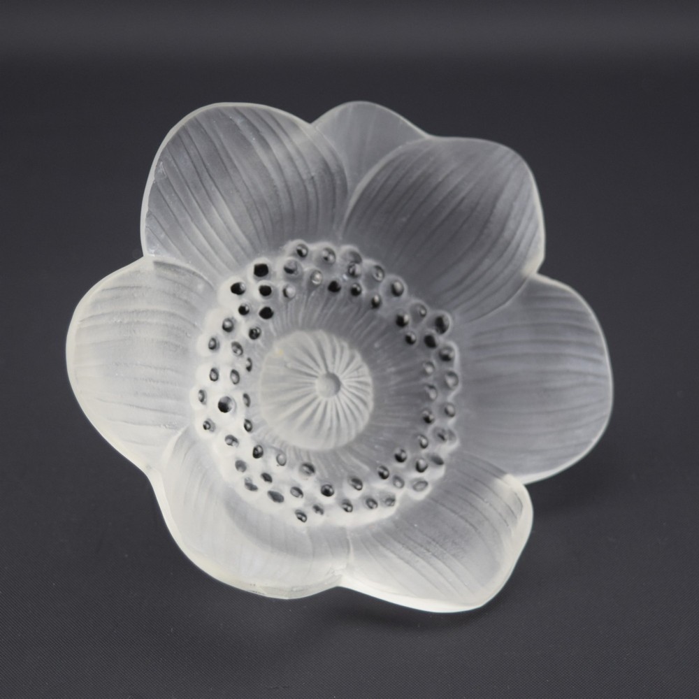 A Rene Lalique frosted clear glass paperweight shaped as an open anemone flower with black enamelled central detail. View III