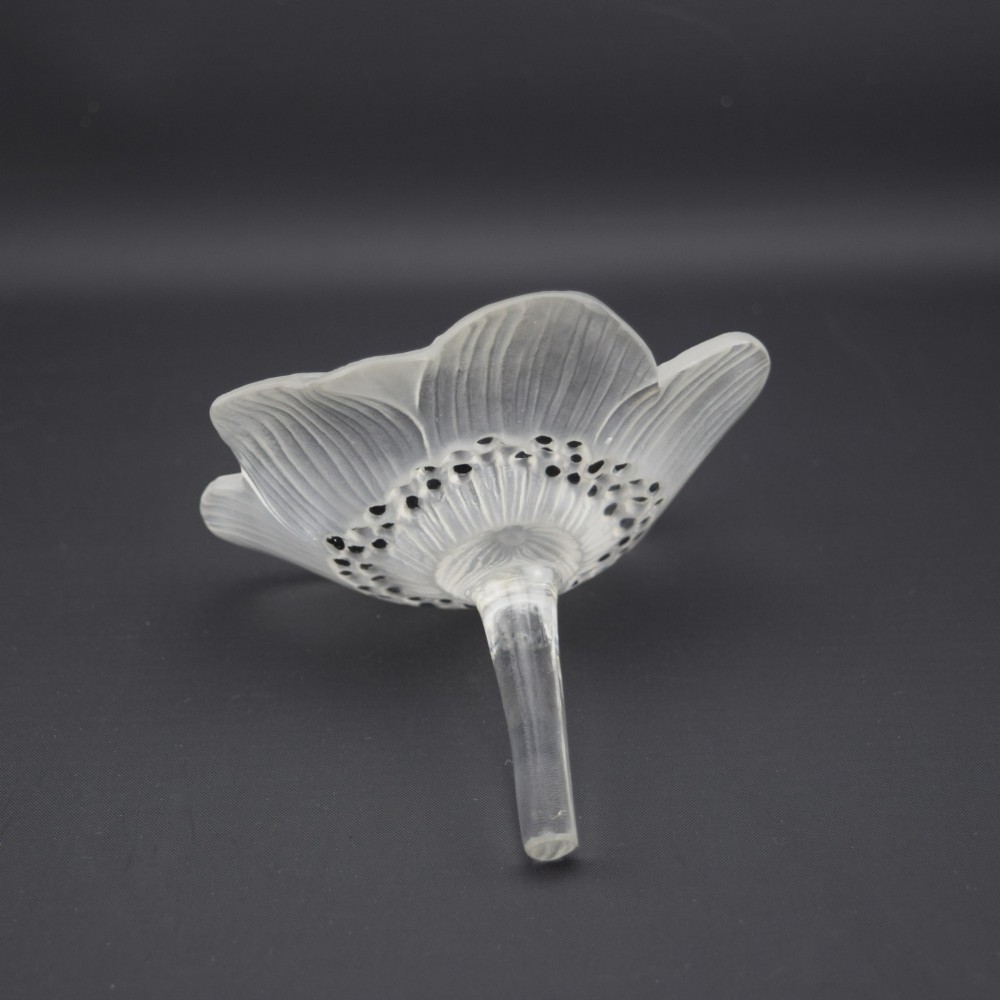 A Rene Lalique frosted clear glass paperweight shaped as an open anemone flower with black enamelled central detail. View IV