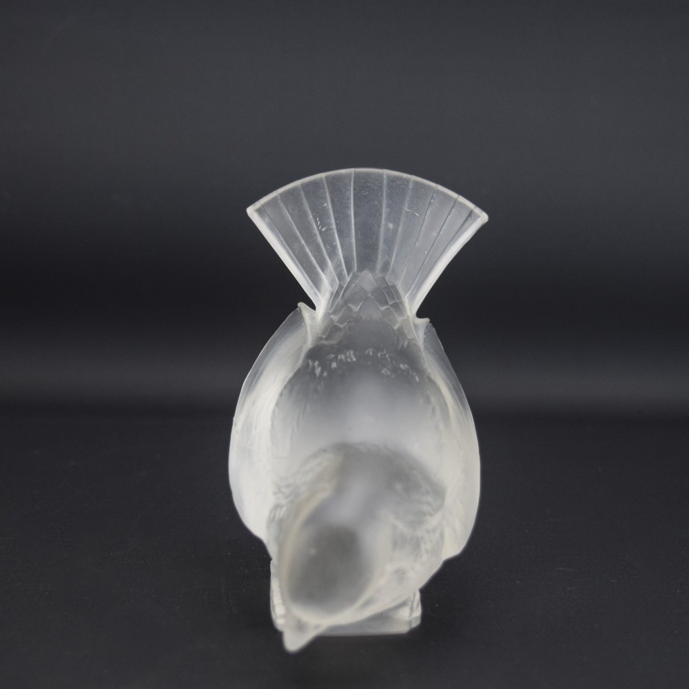 An Art Deco clear and frosted glass paperweight depicting a sparrow with its head lowered in a foraging pose. View II