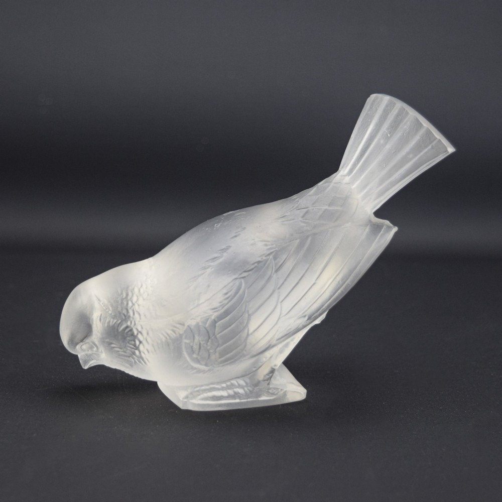 An Art Deco clear and frosted glass paperweight depicting a sparrow with its head lowered in a foraging pose. View III