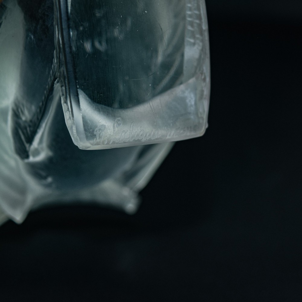 An Art Deco clear and frosted glass paperweight depicting a sparrow with its head lowered in a foraging pose. View VI