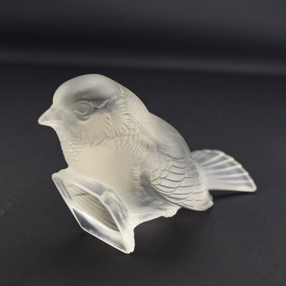 An Art Deco clear and frosted glass paperweight depicting a sparrow with its head lowered in a foraging pose. View VII