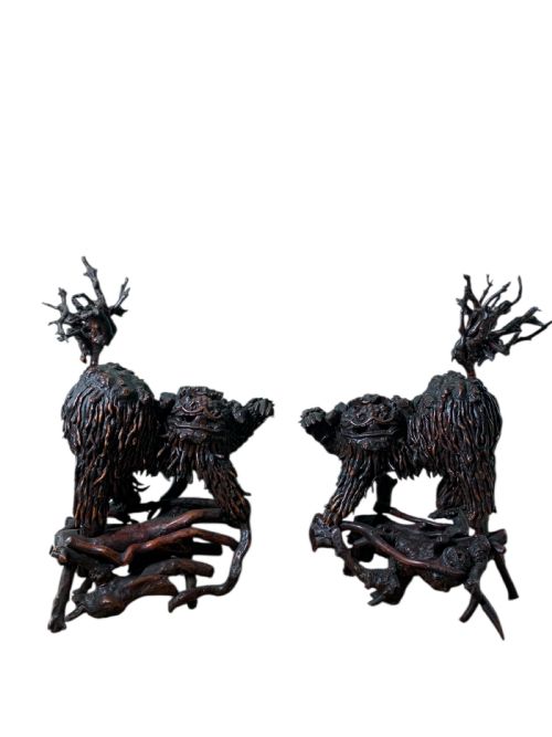 fig 1. A pair of dark carved root wood Chinese guardian lion sculptures raised on organic natural root bases.
