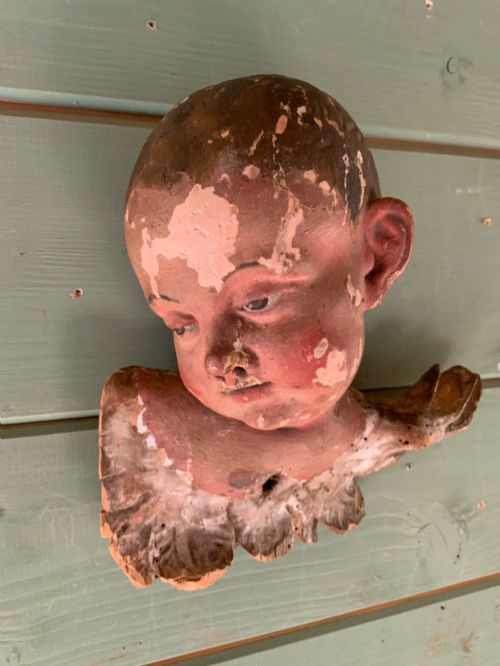 An Early 18th C Carving of a Putto