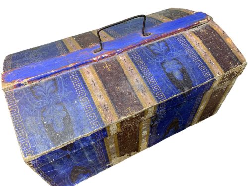 fig 2. An 18th-century domed-top wooden dowry box covered in patterned blue and brown block-printed paper with iron hardware.