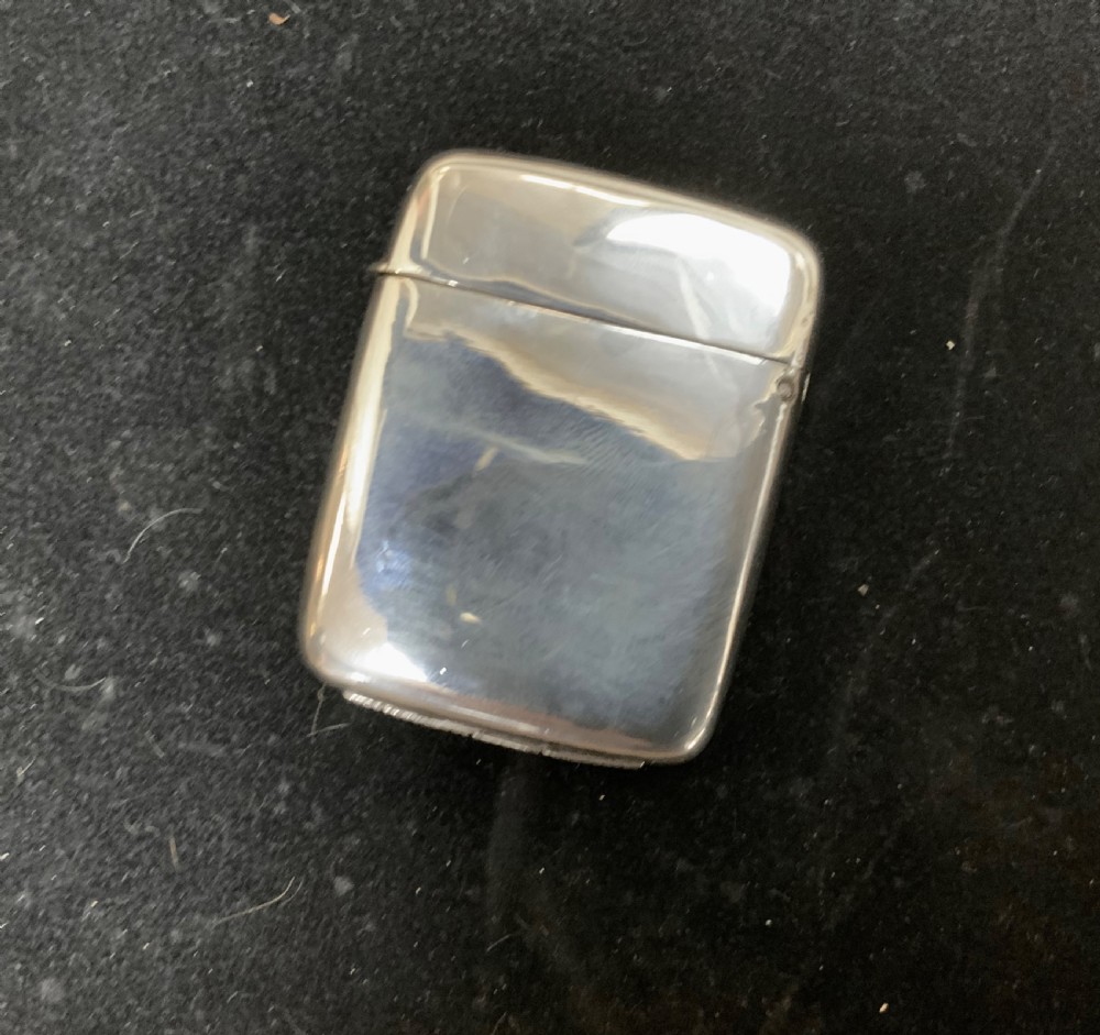A VICTORIAN SILVER & ENAMEL VESTA CASE WITH PUG PORTRAIT View III