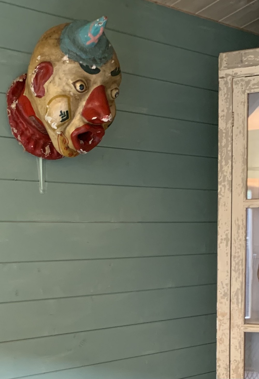 A RARE OVERSIZED EARLY FAIRGROUND PAPIER MÂCHÉ CLOWN’S HEAD