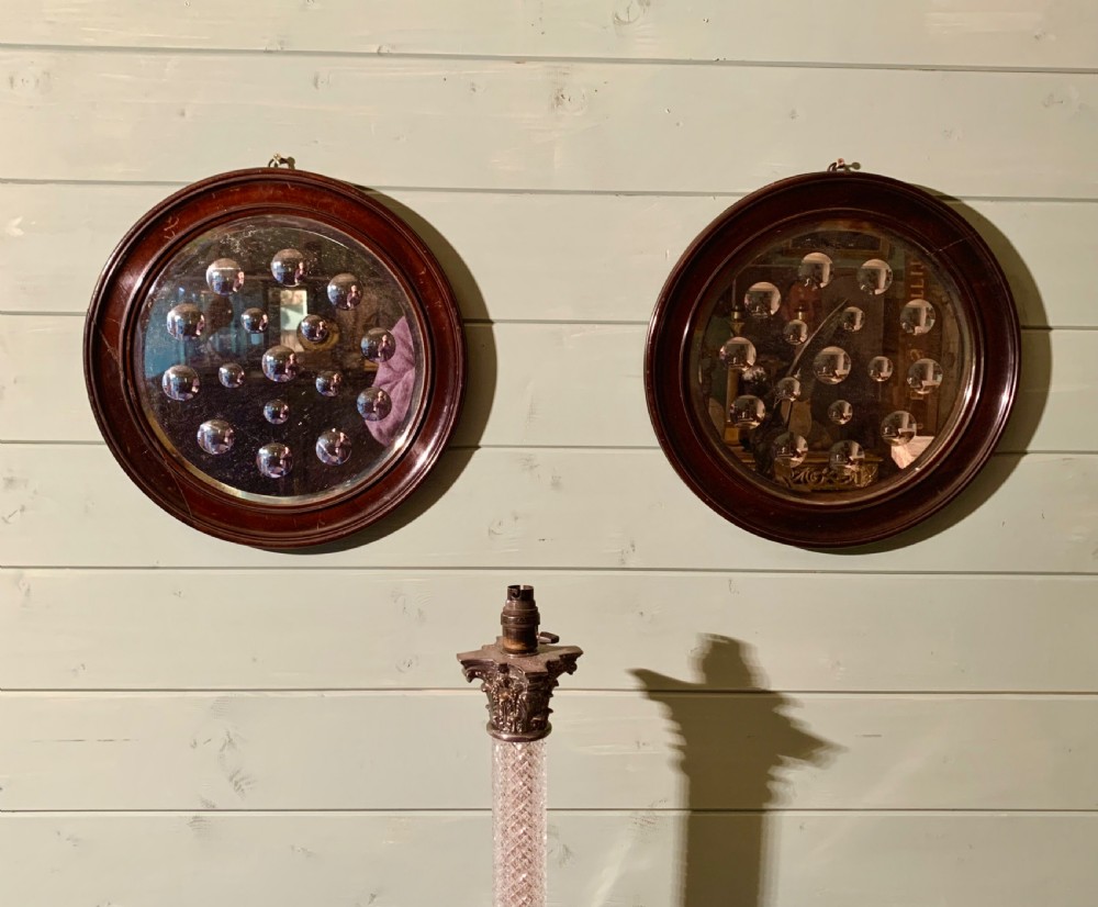 A LARGE PAIR OF SORCERERS MIRRORS