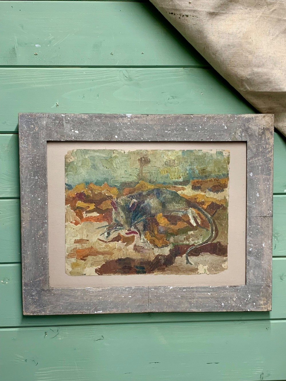 An antique French Impressionist oil study depicting a rodent amongst earthy foliage within a weathered grey wooden frame.