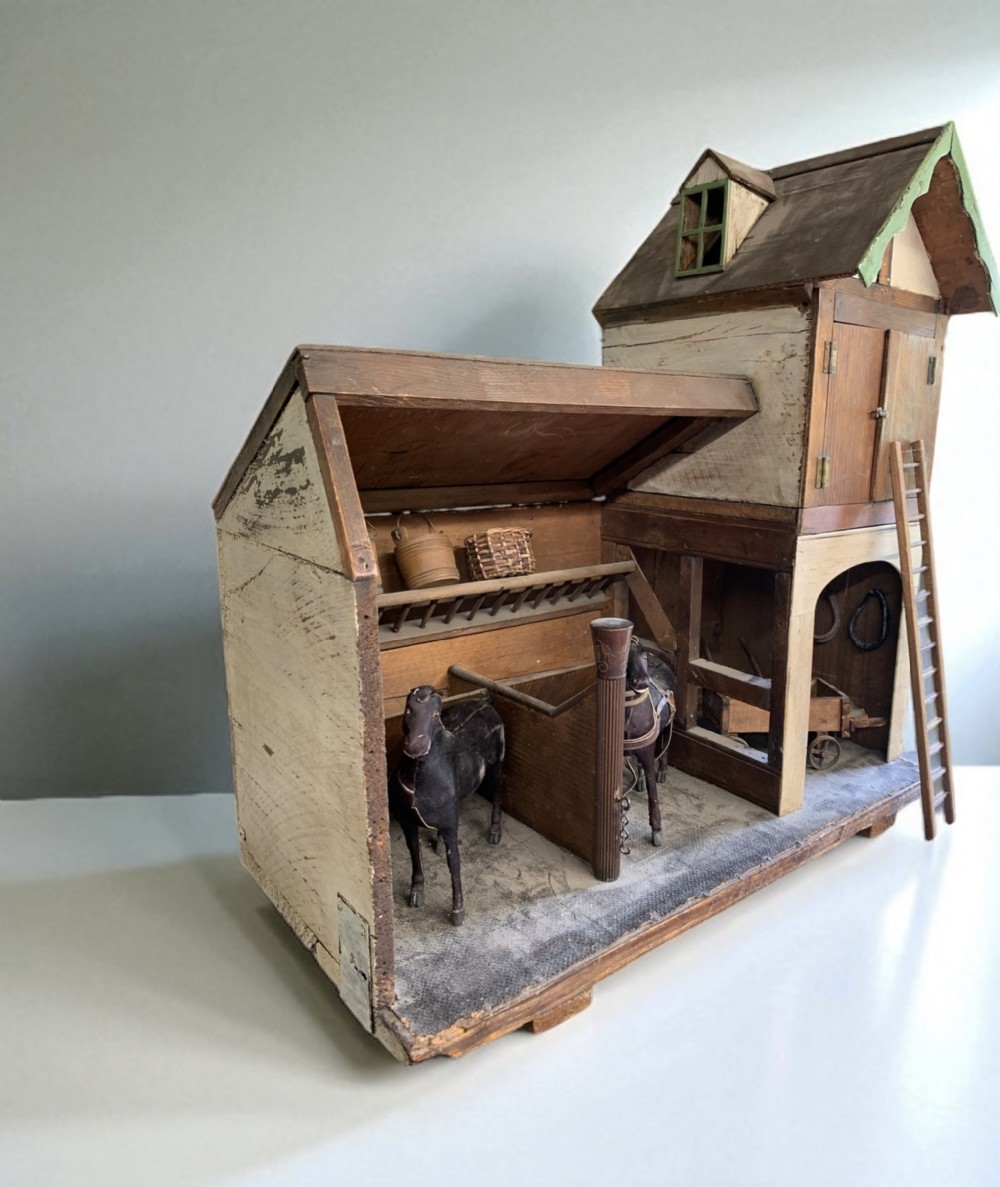 FOLK ART - A WOODEN MODEL OF A STABLE WITH HORSES