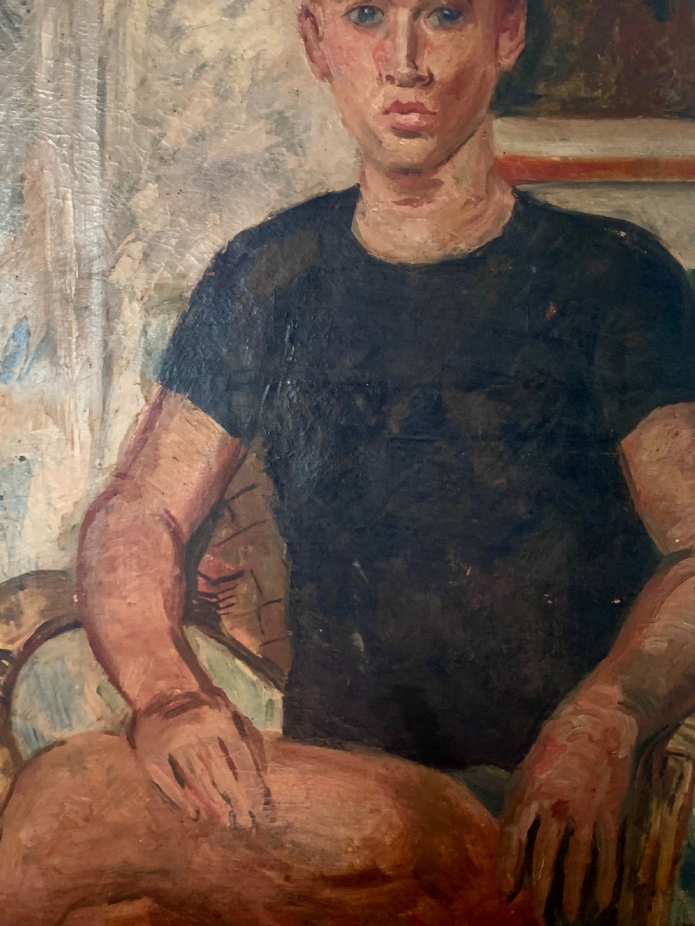 An oil painting on canvas featuring a seated young man in a dark short-sleeved shirt against a textured background. View V