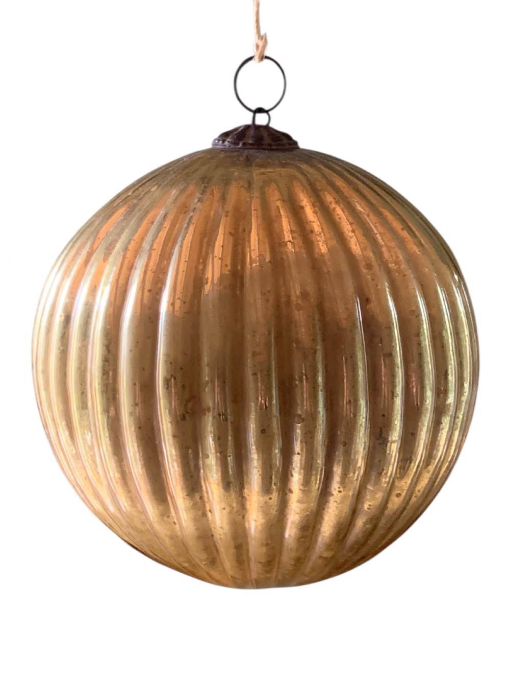 A spherical ribbed mercury glass kugel ornament displaying a silvered aged gold finish and top metal hanging loop. View III